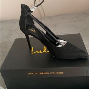 Black suede pointed toe heels